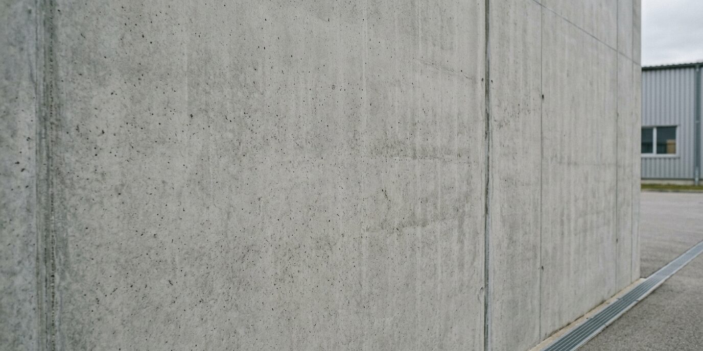 Cleaned exterior concrete wall after professional graffiti spray paint removal.