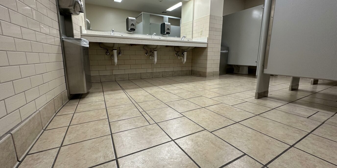 Gleaming grocery store aisle tile floors in Lancaster PA, showcasing professional commercial tile deep cleaning services by Liberty SoftWash.